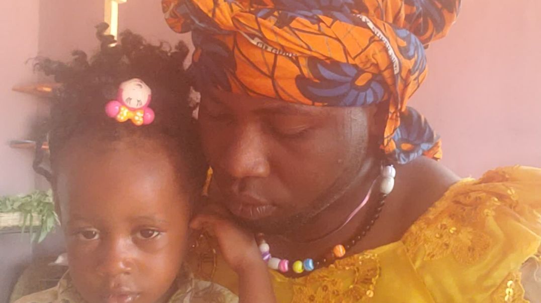 MAMA EBERE'S TV with her grand daughter